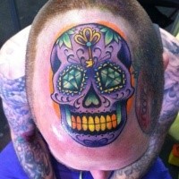 Mexican traditional style colored head tattoo of funny looking skull
