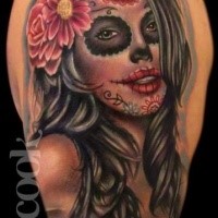 Mexican traditional style colored shoulder tattoo of woman portrait with flowers