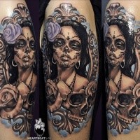 Mexican traditional style colored tattoo of woman with skull and flowers