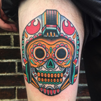 Mexican traditional style colored thigh tattoo of cute skull with helmet