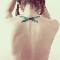 Minimalist green dragonfly tattoo on back for women