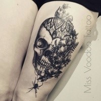 Modern looking black ink thigh tattoo of big human skull with flowers and spider by Caro Voodoo