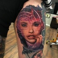 Modern looking colored thigh tattoo of woman portrait