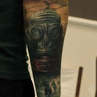 Modern military style colored forearm tattoo of gas mask and running zombies
