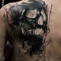 Modern style 3D like black ink scapular tattoo of demonic human skull