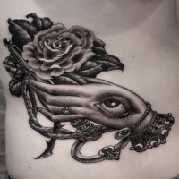 Modern style black ink back tattoo of mystical human hand with rose and key