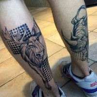 Modern style black ink leg tattoo of elk and rhino