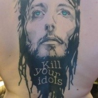 Modern style colored back tattoo of Jesus portrait with lettering