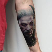 Modern style colored forearm tattoo of video game Witcher