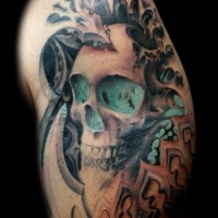 Modern style colored shoulder tattoo of human skull with ornaments