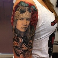 Modern style colored shoulder tattoo of Guns n Roses front man