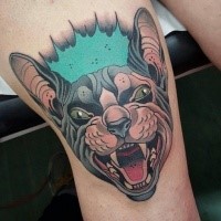 Modern style colored thigh tattoo of evil crazy cat
