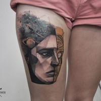 Modern style colored thigh tattoo of human face with planets