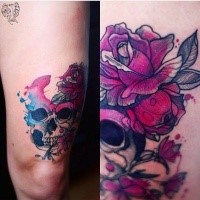 Modern style colored thigh tattoo of human skull with flower by Joanna Swirska