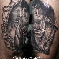 Modern style colored thigh tattoo of woman with sand clock and rose