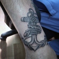 Modern style detailed arm tattoo of anchor with snake