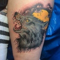 Modern traditional colored thigh tattoo of werewolf with yellow moon