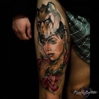 Modern traditional colored thigh tattoo of woman portrait with wolf and roses