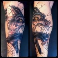 Modern traditional style colored arm tattoo of demonic wolf