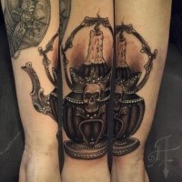 Modern traditional style colored arm tattoo of tea pot with skull and candle