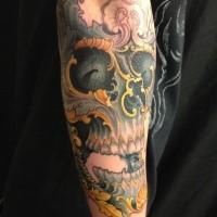 Modern traditional style colored arm tattoo of human skull