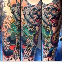 Modern traditional style colored arm tattoo of sweet looking cat with Egypt symbols