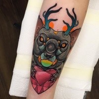 Modern traditional style colored forearm tattoo of mystical bear with deer horns