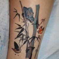 Modern traditional style colored leg tattoo of bamboo with butterflies