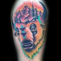 Modern traditional style colored shoulder tattoo of grunting ox with mountains and forest