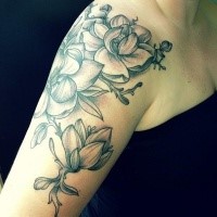 Modern traditional style colored shoulder tattoo of funny flowers