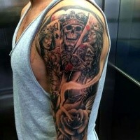 Modern traditional style colored shoulder tattoo of cool looking playing cards with roses