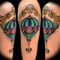 Modern traditional style colored shoulder tattoo of balloon with elephant