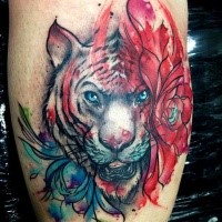 Modern traditional style colored tattoo of white tiger and flowers