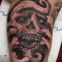 Ugly monster skull tattoo