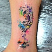Multicolored ankle tattoo of small glass