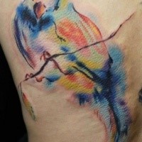 Multicolored bird sitting on the branch tattoo in watercolor style