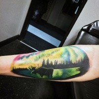 Multicolored elk on wildlife scenery oval shaped arm tattoo