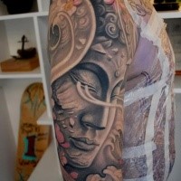 Multicolored sleeve tattoo of Buddha statue and flowers