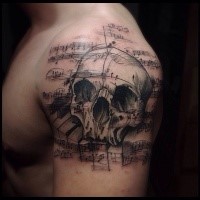 Music themed black ink shoulder tattoo of human skull with notes