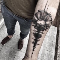 Music themed painted by Inez Janiak forearm tattoo of disk with shadow on water