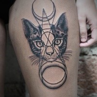 Mysterious style black ink thigh tattoo of cat head with mystical ornaments