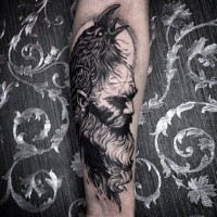 Mystical black ink forearm tattoo of man with beard and cow