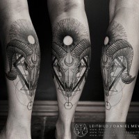 Mystical black ink leg tattoo of animal skull with geometrical ornaments