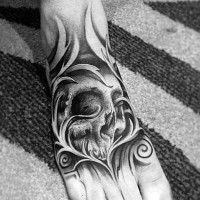 Mystical black ink old skull in fog tattoo on foot