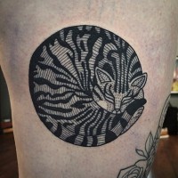 Mystical black ink thigh tattoo of sleeping cat