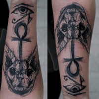 Mystical black work style Egypt cat with eye of Horus symbol tattoo on forearm