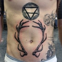 Mystical blackwork style belly tattoo of cult triangle symbol and deer horns