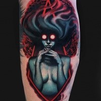 Mystical cool looking colored arm tattoo of demonic woman with red eyes