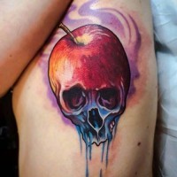Mystical designed little half apple half skull tattoo on side