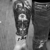 Mystical half witch half animal two sided tattoo on arm